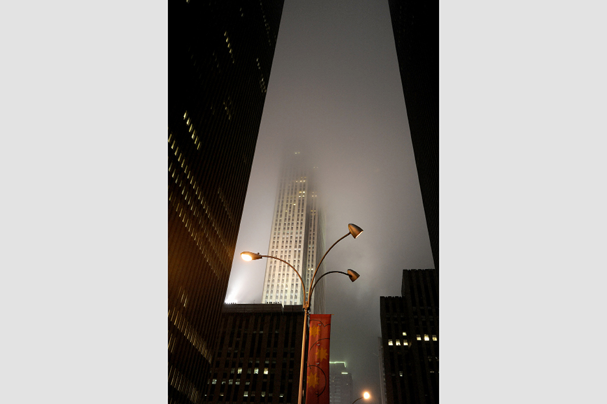 Skyscraper at night through mist and drizzle, Manhattan, 2011. Photograph by David Rowley