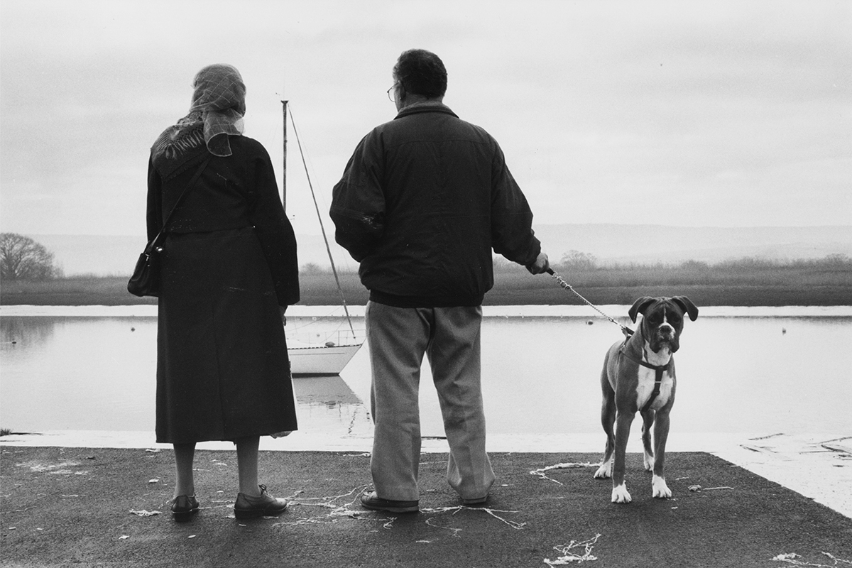 A couple out for a stroll with their dog on New Year’s Day, Topsham, Devon, 2000. Photograph by David Rowley